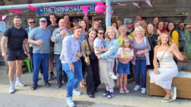Emily McDonald, pictured centre, at the surprise welcome home party thrown for her at Gee Whites