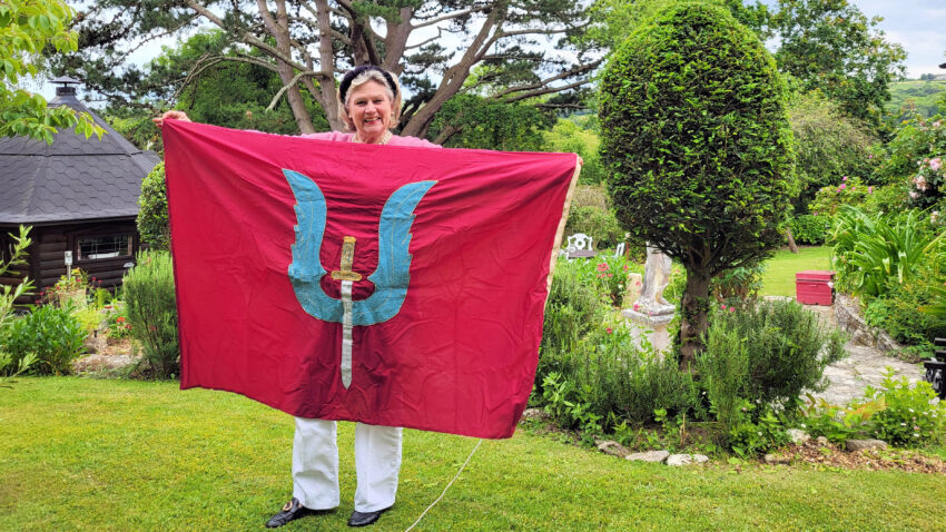 Joanna Weaver displays an SAS regimental flag, one of her father's souvenirs from his days as a wartime hero